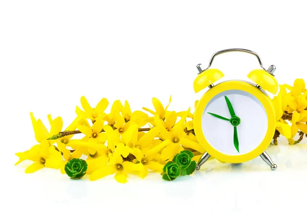 Spring yellow concept with clock and flowers — Stock Photo, Image