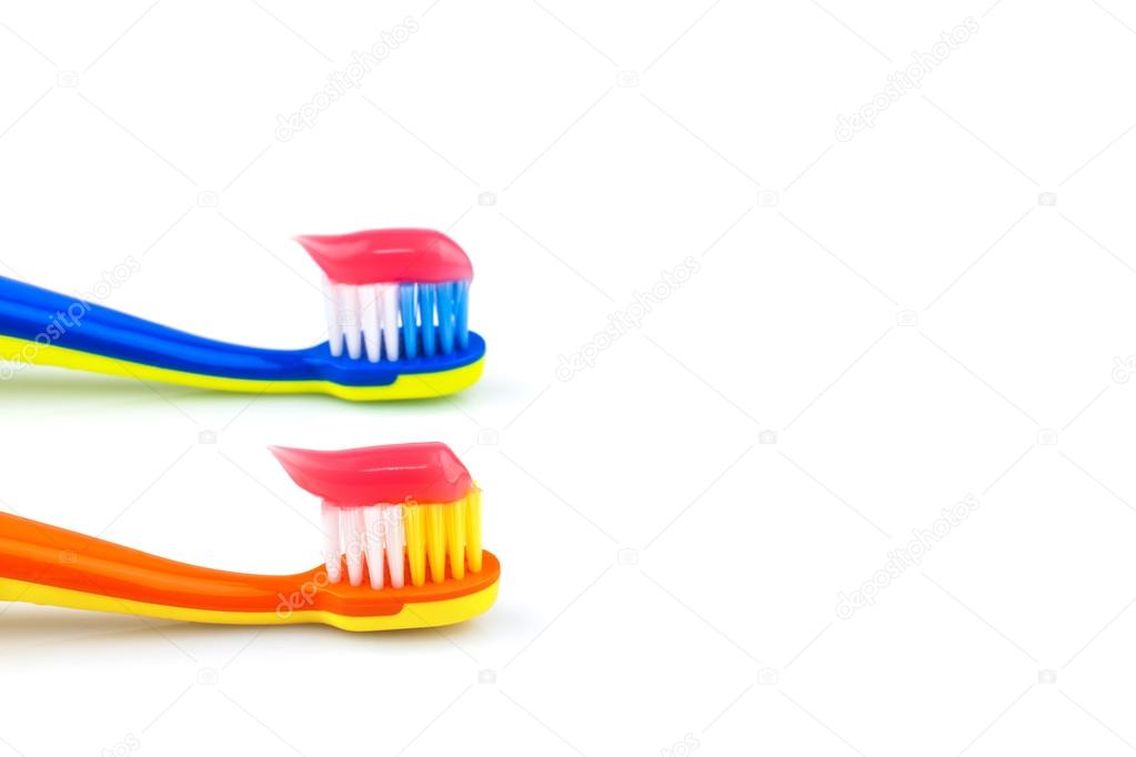 Colorful toothbrushes with toothpaste