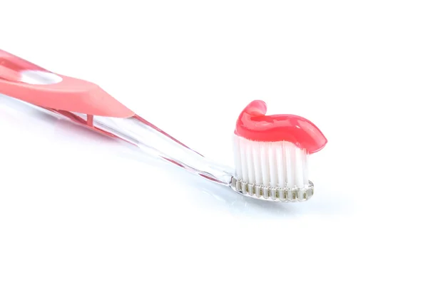 Tandenborstel met roze tandpasta — Stockfoto