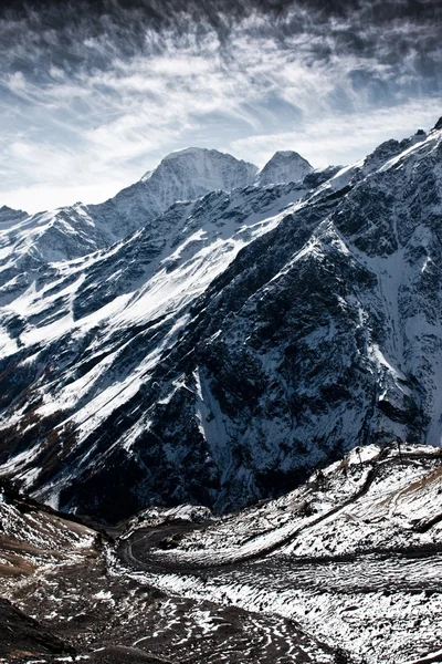 Severe mountains covered with snow — Stock Photo, Image