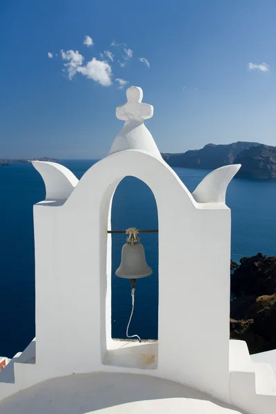 See view through white church arch and bell Santorini Greece Royalty Free Stock Photos