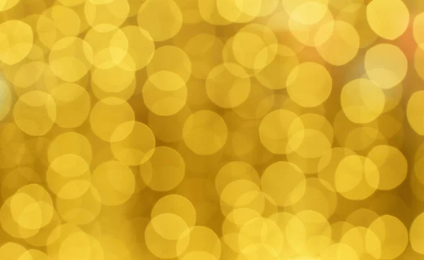 Fondo bokeh dorado. Lámina de textura y confeti bokeh, luz de polvo dorado. Fiesta festiva Navidad y año nuevo fondo víspera. —  Fotos de Stock