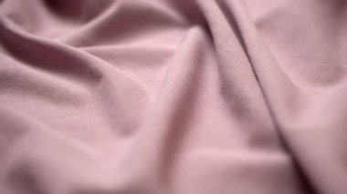Kumaş arka plan. Dokuma kumaşı tekstil malzemesi yakın çekim. Dalgalı kıvrımlı kumaş terzi masasında