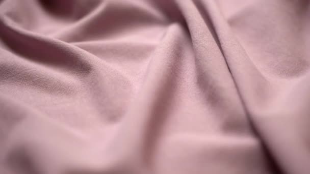 Fabric cloth background. Texture cotton textile material closeup. Wavy pleated fabric on a tailors table — 图库视频影像