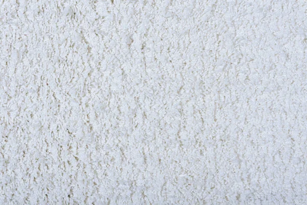 Mattan struktur bakgrund. Vit bomullsmatta för golvbeläggningar. Material för inredning och dekoration av vardagsrum — Stockfoto