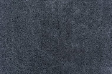 Halı dokusu arka planı. Zemin kaplamaları için siyah gri pamuk halı. Oturma odalarının iç tasarımı ve dekorasyonu için malzeme