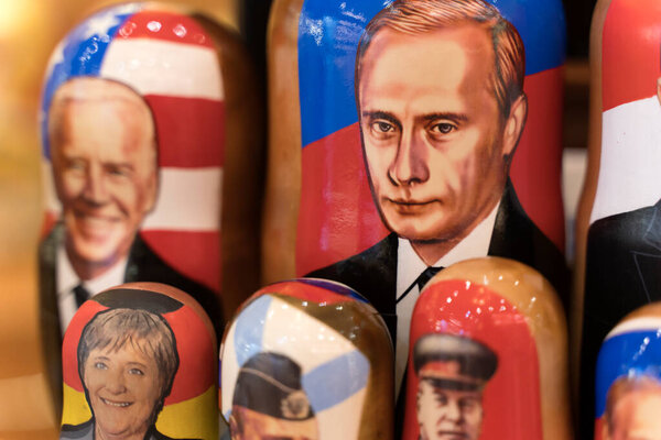 Moscow, Russia - February 26, 2022: Putin and Biden in the form of Russian nesting dolls in a gift shop in Moscow. Relations between Russia and USA
