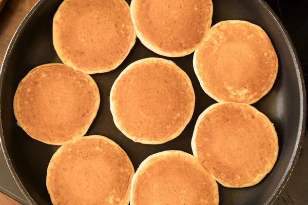 Pancakes in a pan. Delicious homemade pancakes background cooking for breakfast or lunch. High quality photo