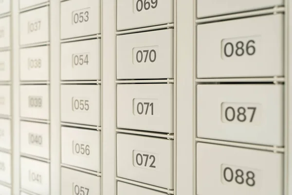 Mailboxes for letters and correspondence. Modern white mailboxes with numbers in the lobby of a residential or office building. High quality photo