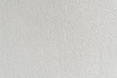 Alçı kaplamalı beyaz duvar. Sıva ve macun tanecikli yüzey dokusu. Bitirici, dekor konsepti. Yüksek kalite fotoğraf