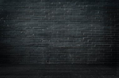 Black brick wall background. Dark brickwork. Copy space. High quality photo