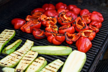 Grilled barbecue vegetables. Summer vegetables peppers and zucchini are roasted and cooked outside for a picnic. Vegan food, gluten free, healthy eating and lifestyle concept. High quality photo