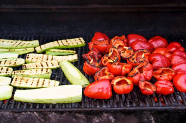 Grilled barbecue vegetables. Summer vegetables peppers and zucchini are roasted and cooked outside for a picnic. Vegan food, gluten free, healthy eating and lifestyle concept. High quality photo