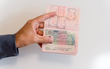 Russian passport in the hands of a man. Prohibition of Schengen visas for Russian tourists to travel to the European Union concept. High quality photo