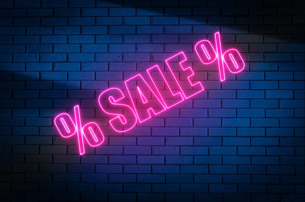 Sale background. Neon pink inscription SALE on a dark brick wall. Shopping, sales, concept. High quality photo