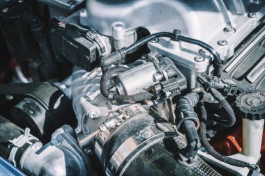 Engine of a modern car. Device and detailing of the transport motor.Automotive, motors, manufacturing concept. High quality photo