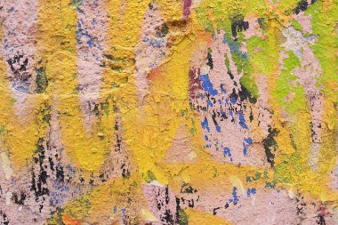 Wall with old peeling paint and plaster. Urban, street, colorful abstract background. High quality photo