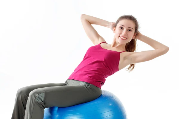 Fitness antrenmanı. Bisiklet Çıtırdatan Sporcu Kadın Pembe ve Mavi Neon Stüdyo Arkaplanı Üzerinde Yerde Uyurken Abur cubur Egzersizi Yapıyor. Azimli bayan, beyaz spor giyer, karın kaslarını çalıştırır.