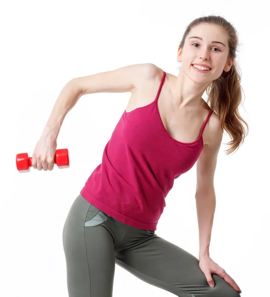 Fitness antrenmanı. Bisiklet Çıtırdatan Sporcu Kadın Pembe ve Mavi Neon Stüdyo Arkaplanı Üzerinde Yerde Uyurken Abur cubur Egzersizi Yapıyor. Azimli bayan, beyaz spor giyer, karın kaslarını çalıştırır.