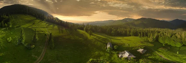 Wide-angle panoramic shot of beautiful meadows, hills and trees in Synevyrska glade next to Synevyr lake. Majestic and wonderful landscapes of the Carpathian mountains in Ukraine — Stock Photo, Image