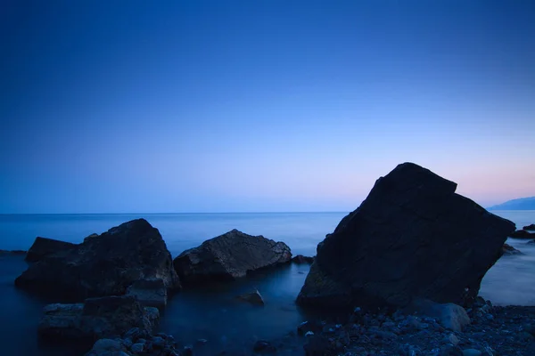 Sea rocks at sunset. Breathtaking sunset view on the Black Sea coast, Crimea. — Stock Photo, Image