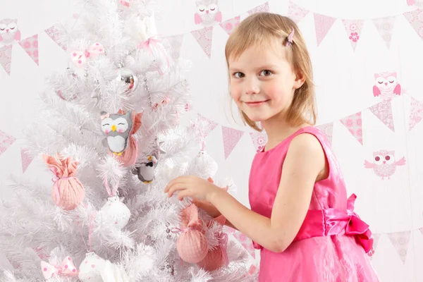 Beautiful young girl with fir — Stock Photo, Image