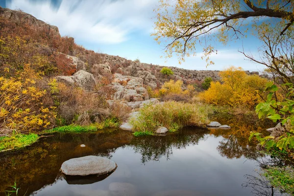 stock image A small wonderful lake along a picturesque river flowing through a beautiful canyon. Huge hatches are in the water. Ukraine.