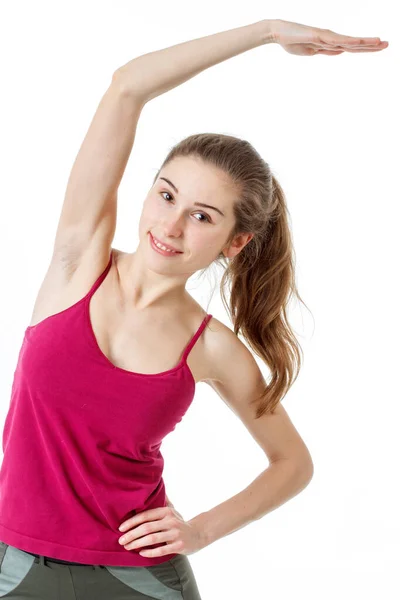 Fitness-Workout. Sporty Woman Doing Bicycle Crunch Abs Übung auf dem Boden liegend über rosa und blauen Neon Studio Hintergrund. Entschlossene Dame trägt weiße Fitwear-Trainingsanzüge, die die Bauchmuskeln anspannen — Stockfoto