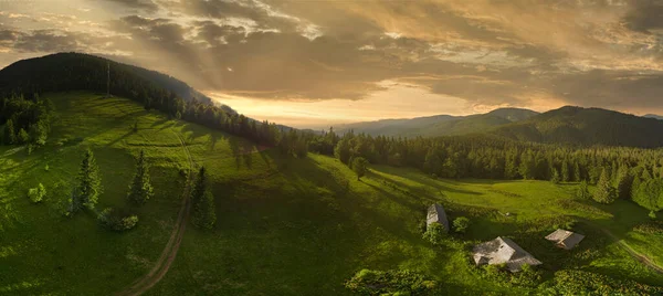 Wide-angle panoramic shot of beautiful meadows, hills and trees in Synevyrska glade next to Synevyr lake. Majestic and wonderful landscapes of the Carpathian mountains in Ukraine — Stock Photo, Image
