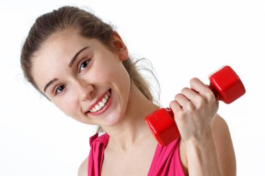 Fitness antrenmanı. Bisiklet Çıtırdatan Sporcu Kadın Pembe ve Mavi Neon Stüdyo Arkaplanı Üzerinde Yerde Uyurken Abur cubur Egzersizi Yapıyor. Azimli bayan, beyaz spor giyer, karın kaslarını çalıştırır.