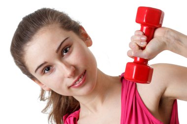 Fitness antrenmanı. Bisiklet Çıtırdatan Sporcu Kadın Pembe ve Mavi Neon Stüdyo Arkaplanı Üzerinde Yerde Uyurken Abur cubur Egzersizi Yapıyor. Azimli bayan, beyaz spor giyer, karın kaslarını çalıştırır.