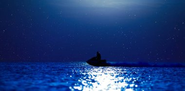 Southern night, wonderland. Moon and star on a calm ocean