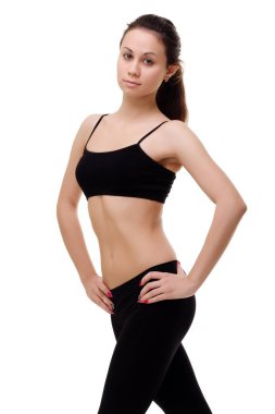 Genç, fit ve güzel esmer kadın spor giyimli, gri giyinmiş. Sağlık, diyet, spor ve spor konsepti.