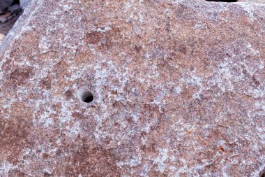 Kırmızı granit doku. Kırmızı mermer desen arkaplanının ayrıntıları kapatıldı.