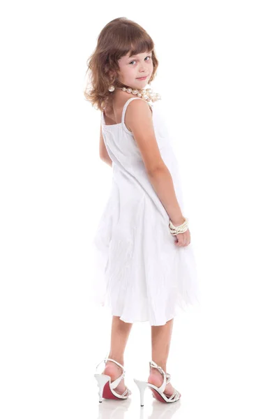 Menina bonita com espaço de cópia branca em um fundo branco — Fotografia de Stock