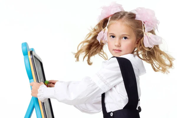 Portrait of a first grader in a school uniform on a white background. — Fotografia de Stock