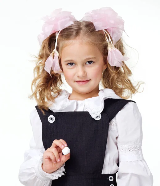 Portrait of a first grader in a school uniform on a white background. — Fotografia de Stock