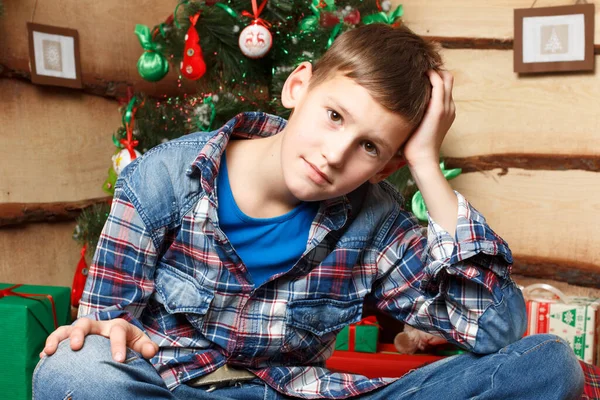 A boy near fir tree in New Years eve — Foto Stock