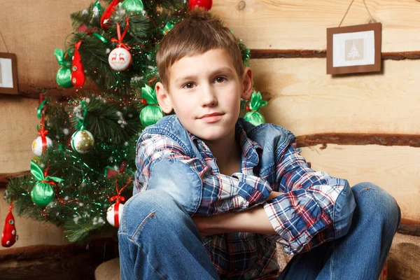 A boy near fir tree in New Years eve — Foto Stock