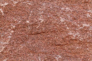 Kırmızı granit doku. Kırmızı mermer desen arkaplanının ayrıntıları kapatıldı.