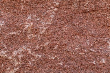 Kırmızı granit doku. Kırmızı mermer desen arkaplanının ayrıntıları kapatıldı.