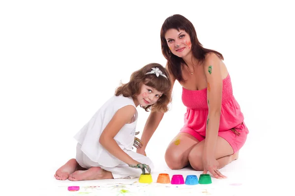 beautiful mommy and her kid paintig a picture for kindergardern. hobby, education, development , child developing painting skills. close up photo