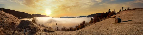 Frozen meadow with a layer of fog during sunrise in the Carpathian mountains, Ukraine. — Photo