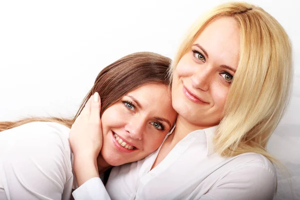 Studio fashion image of two beautiful young women, isolated — Stock Photo, Image