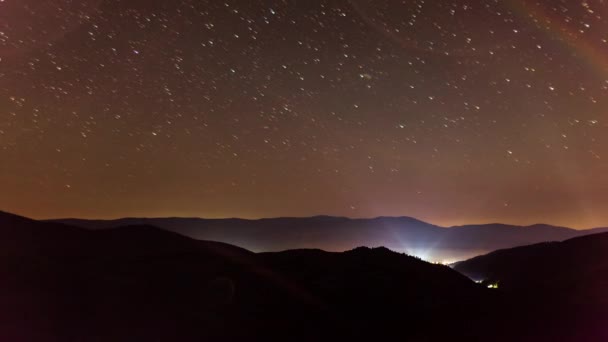 Stars over Carpatian Mountains. Wonderful incredible night sky over Kamenka. A cinematic magical view of the universal space with millions of shining stars. Synevyr Pass, Carpathians, Ukraine. — Stock video