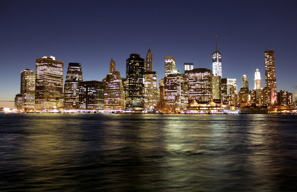 Twilight as the sun sets over Lower Manhattan. Famous New York landmark