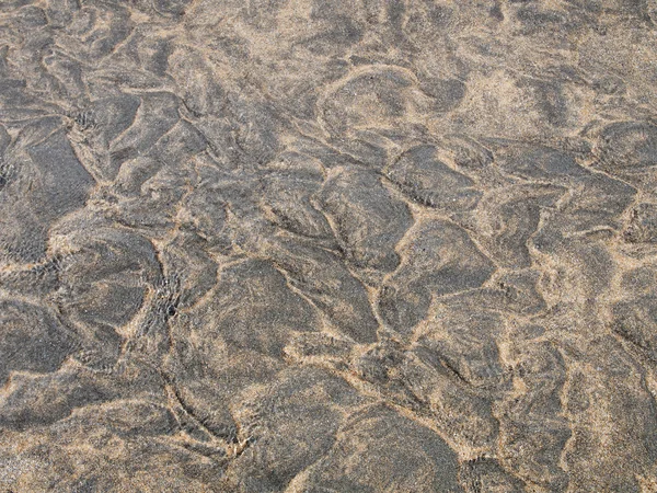 Textura de areia preto e amarelo — Fotografia de Stock