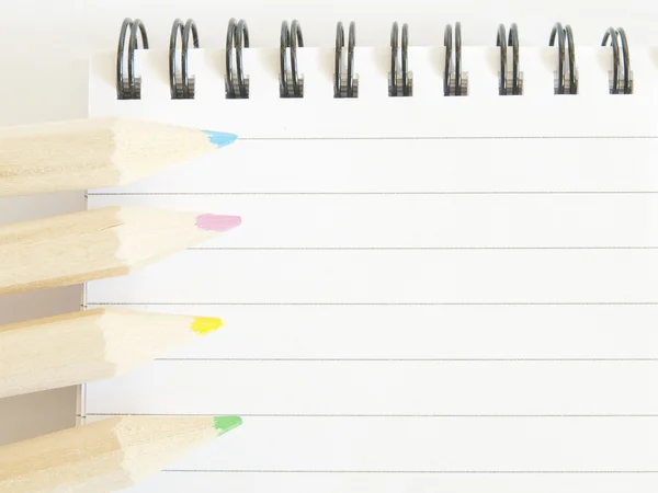 Color pencils and notepad — Stock Photo, Image