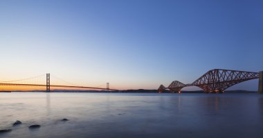 The Forth Road and Rail Bridges at night dusk clipart