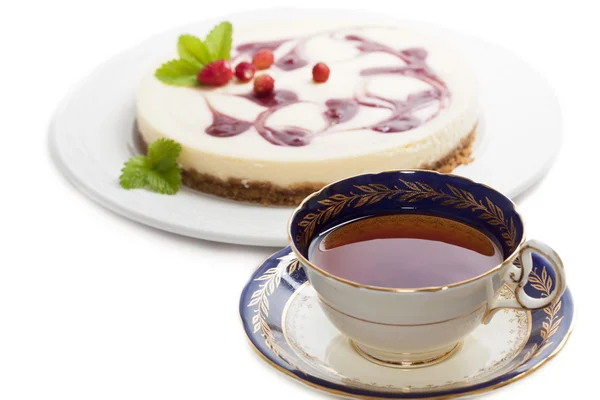 A cup of tea with cheesecake — Stock Photo, Image